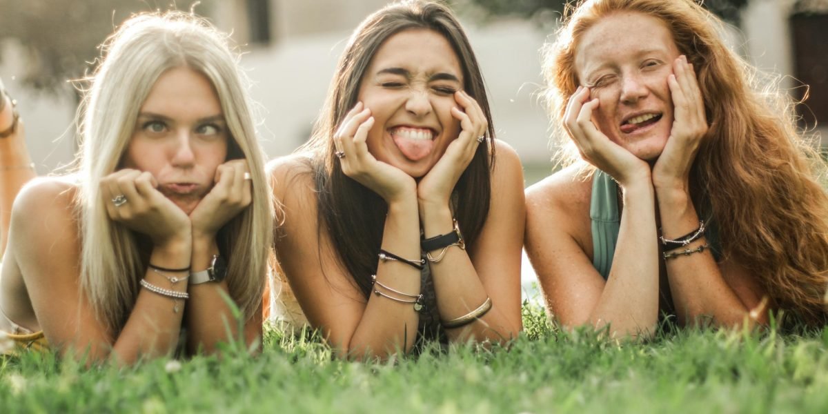 Friends relax and share a moment of fun during a quick mental break from work or study.