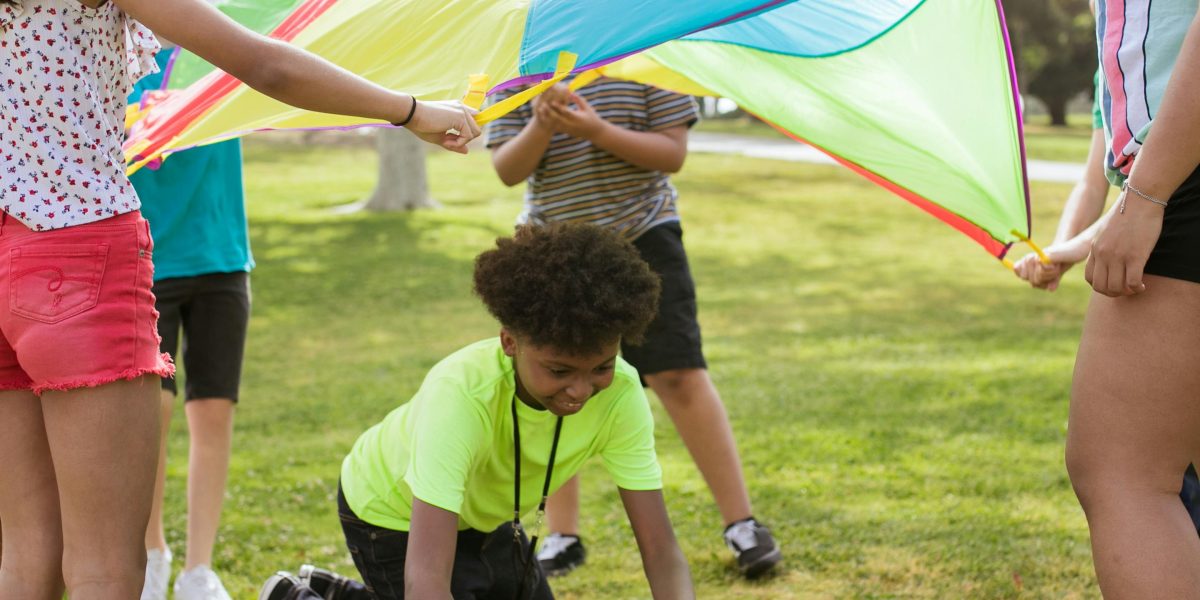 A facilitator actively leading a group, ensuring a positive and engaging experience for all participants.