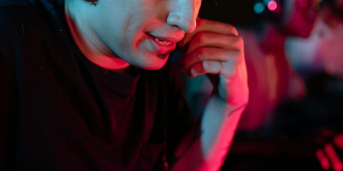 A person deeply engrossed in a video game that requires critical thinking and problem-solving.