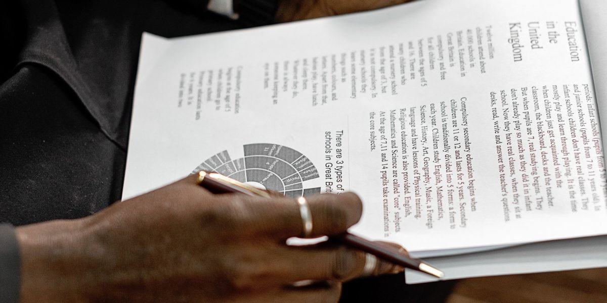A person carefully reviewing documents or a privacy policy on a screen, emphasizing the importance of understanding data sharing.