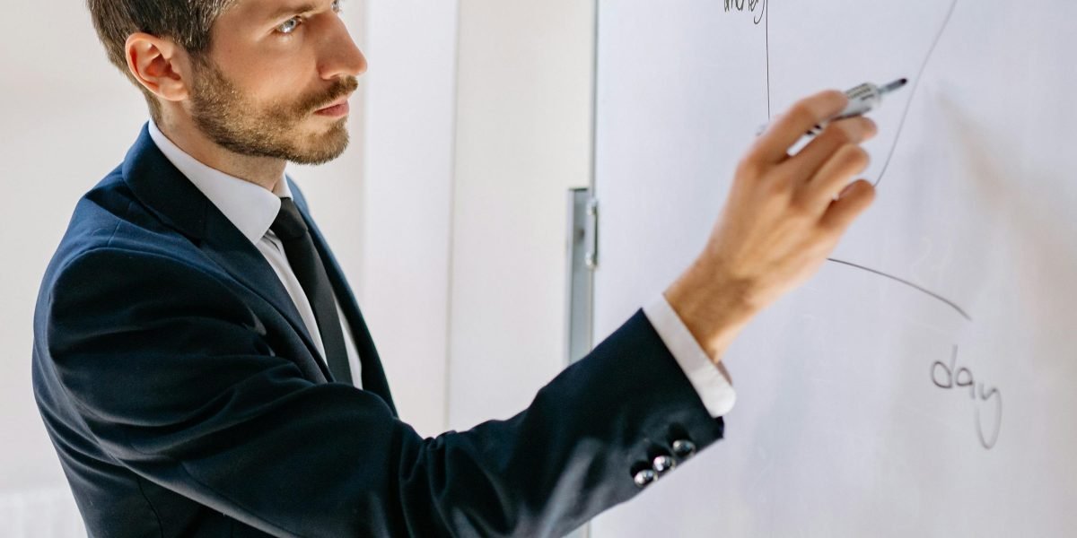 A person actively planning their daily schedule and routines on a whiteboard, reflecting the integration of sleep insights into habits.
