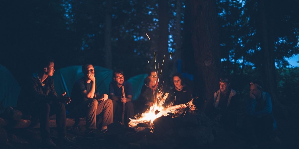 A diverse group of people of varying ages happily engaging in a social activity, promoting mental and emotional well-being.
