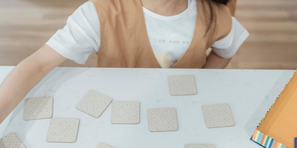 A young child focused on solving a puzzle, developing spatial reasoning skills.