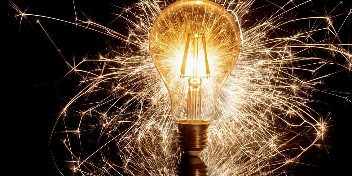 A person in a modern office environment, thinking creatively and innovating new ideas.