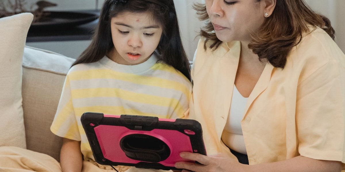 A parent and child sharing a moment of educational screen time, ensuring fun also serves learning.