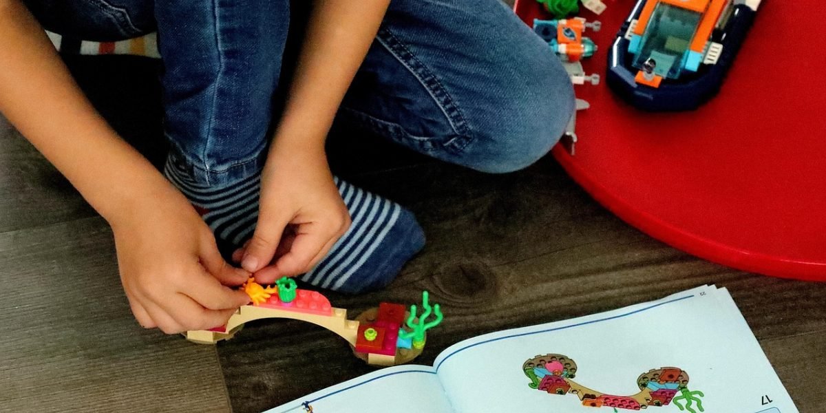 A child intently focused on an educational game, demonstrating engagement and concentration during playtime.