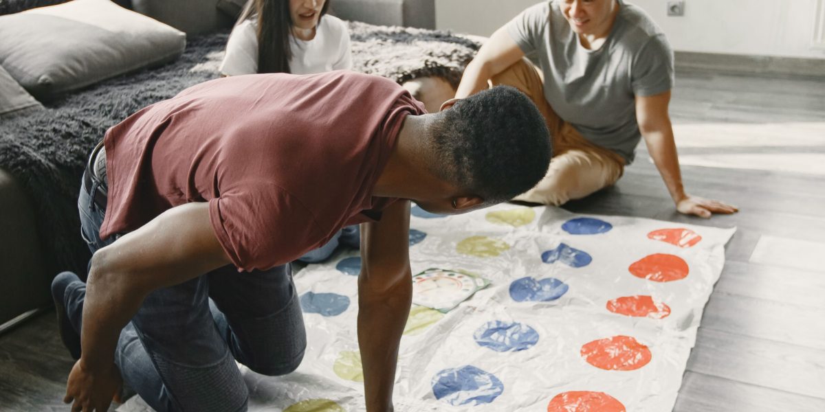 A family or group of friends enjoying a card game, demonstrating social engagement.