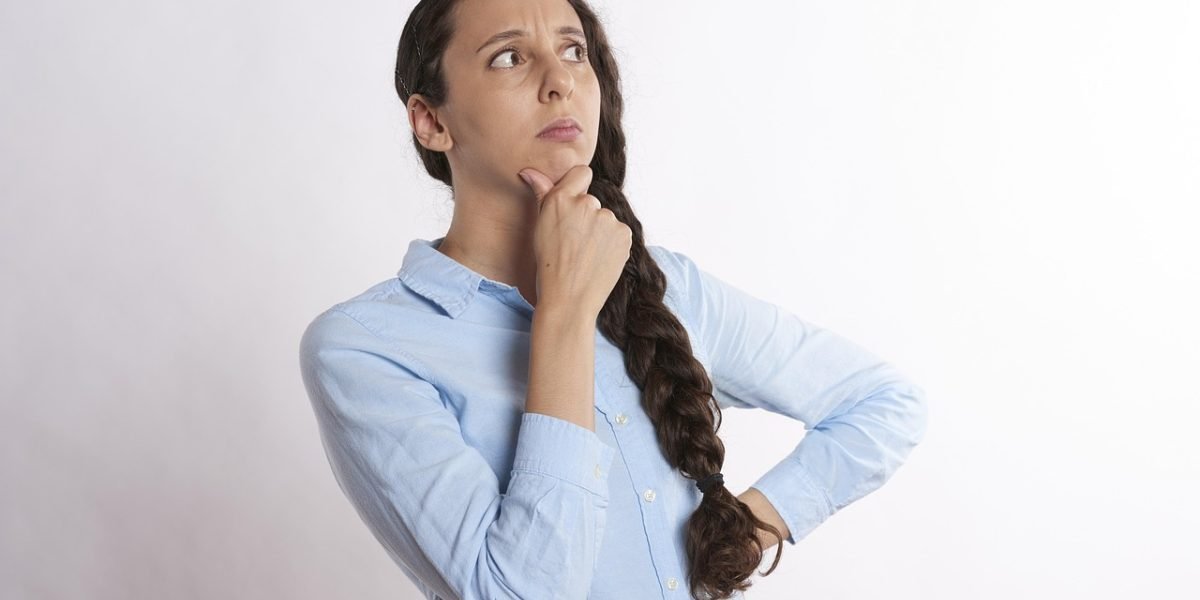 A person engaged in deep thought, representing the critical thinking and problem-solving aspect of brain games.