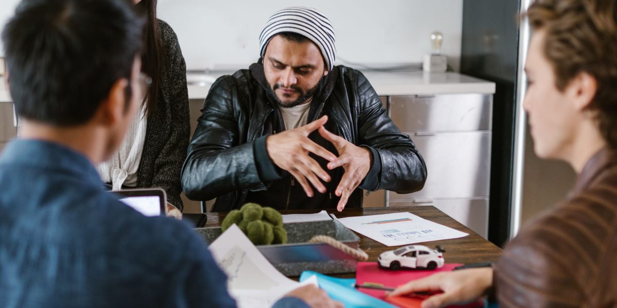 People from diverse backgrounds discussing and understanding different perspectives.